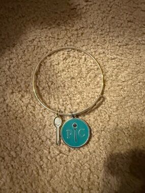 Silver colored Bangle Bracelet with Turquoise Round Charm and Spoon Accent